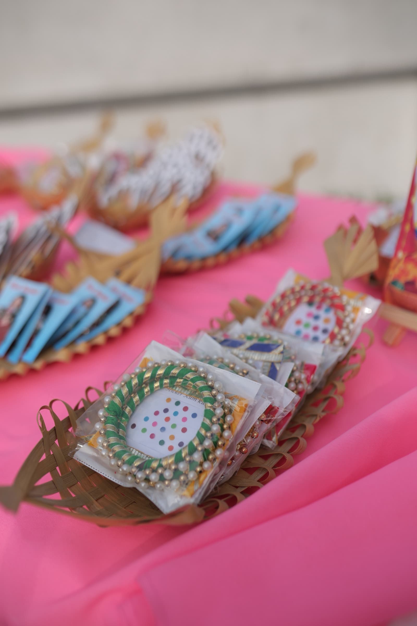 Beaded-frame sticker sachets in woven baskets