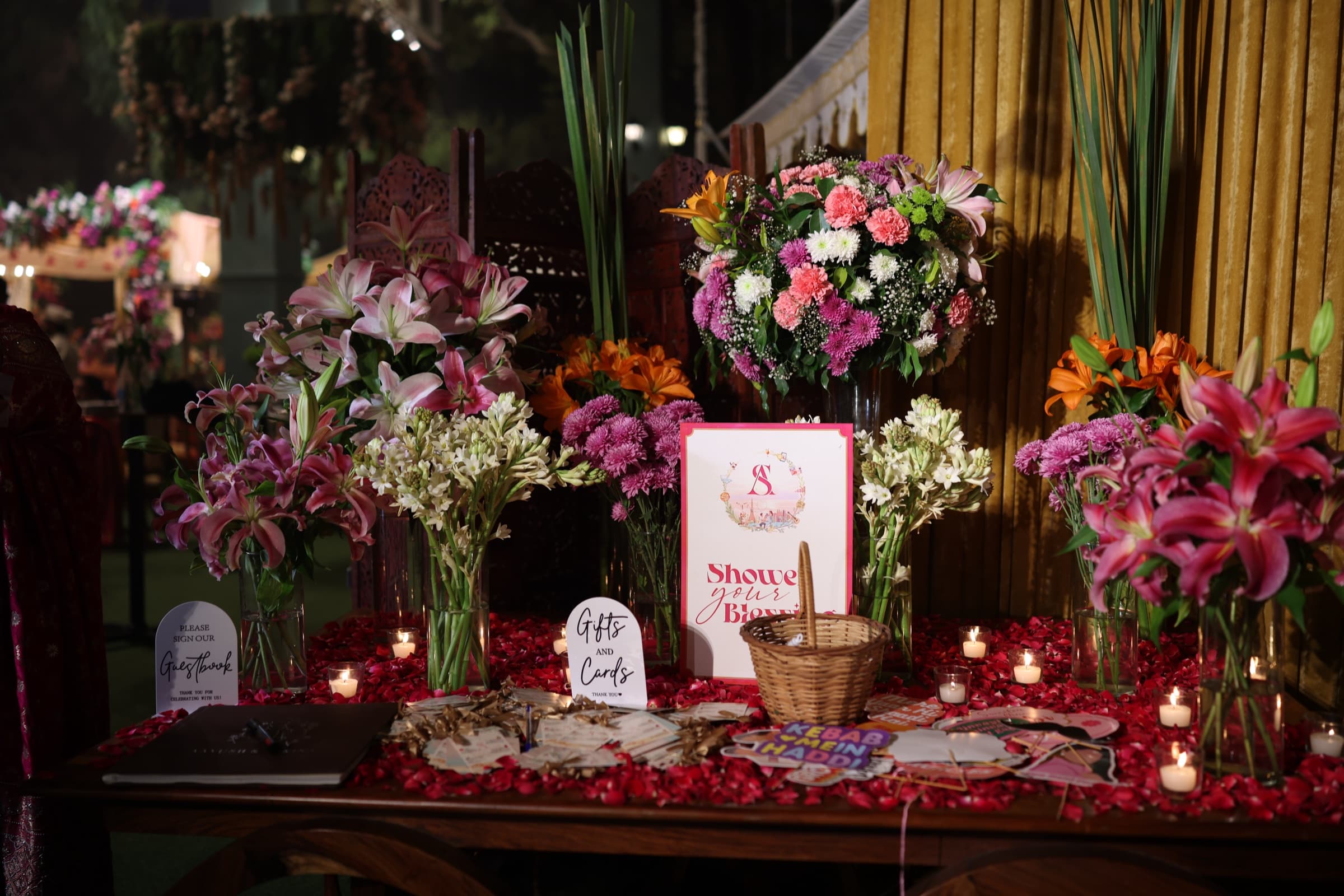 The welcome table styled with florals and signage